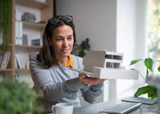 Architect looking at a mockup structure
