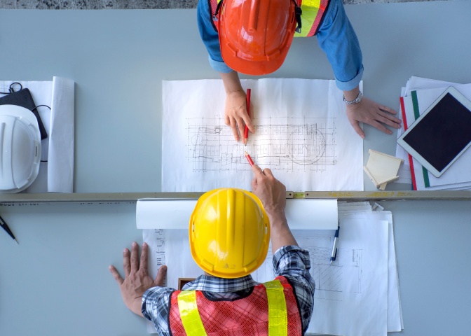 Engineers with hard hats aerial view
